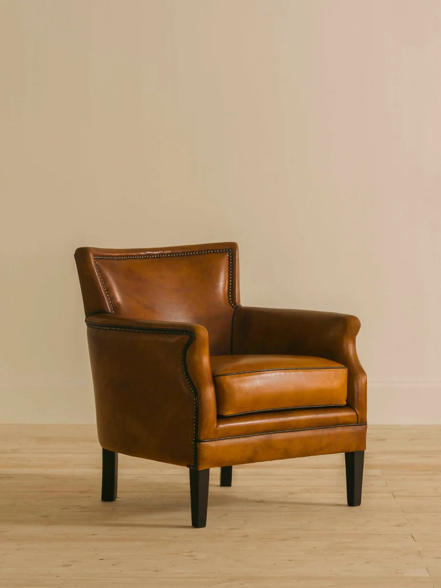 Valentine Single Seater by Chester's India in Shadow Wet Bark leather, with a deep seat, plush cushioning and brass tack finish inspired by late 18th-century Parisian design.