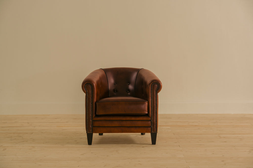 Brown leather armchair on a beige background