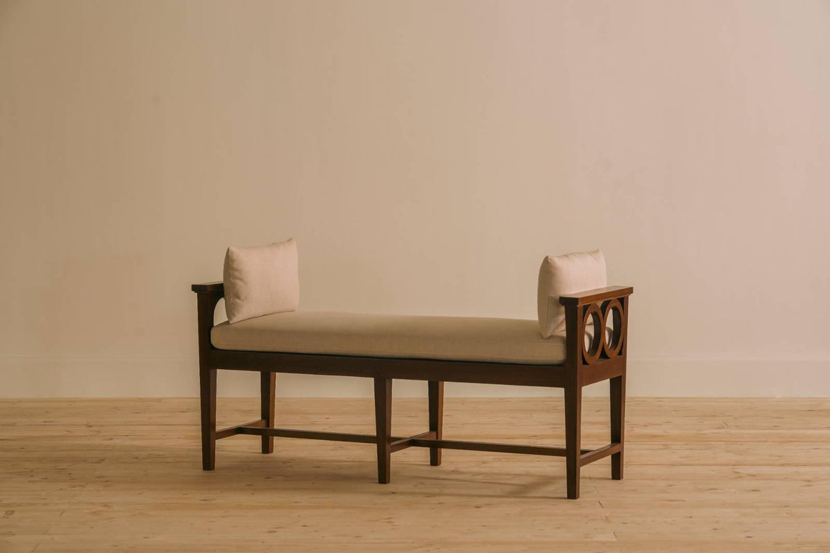 Coventry bench by Chester's India with deep button-tufted top in brown leather and turned wooden legs, ideal as a bed extension or centre console.