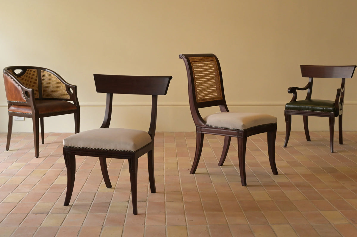 Chester's India dining chair collection featuring the Rattan Tub Chair, Crown Dining Chair, Scroll Dining Chair, and Crown Dining Armchair. Handcrafted in solid mahogany with cane, leather, and fabric upholstery options.