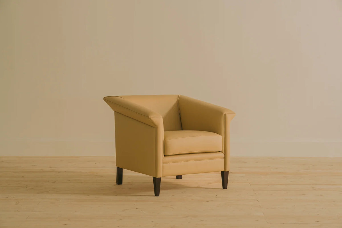 Lieutenant single seater armchair in Nappa Sand leather with a sleek Parisian-inspired silhouette. Handcrafted by Chester's India blending heritage design with modern refinement.