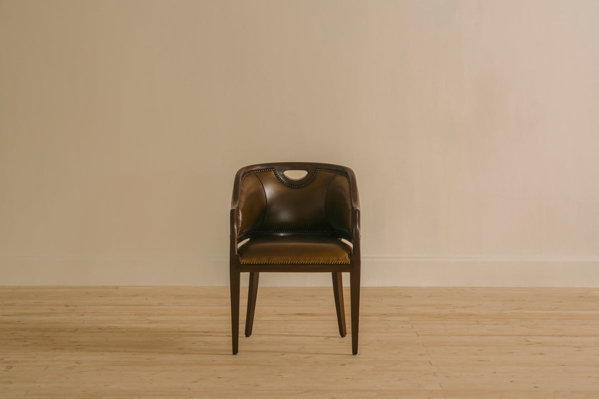 Tub Chair Single Seater by Chester’s India in Shadow Olive leather, with a rounded wraparound back and compact wooden legs.